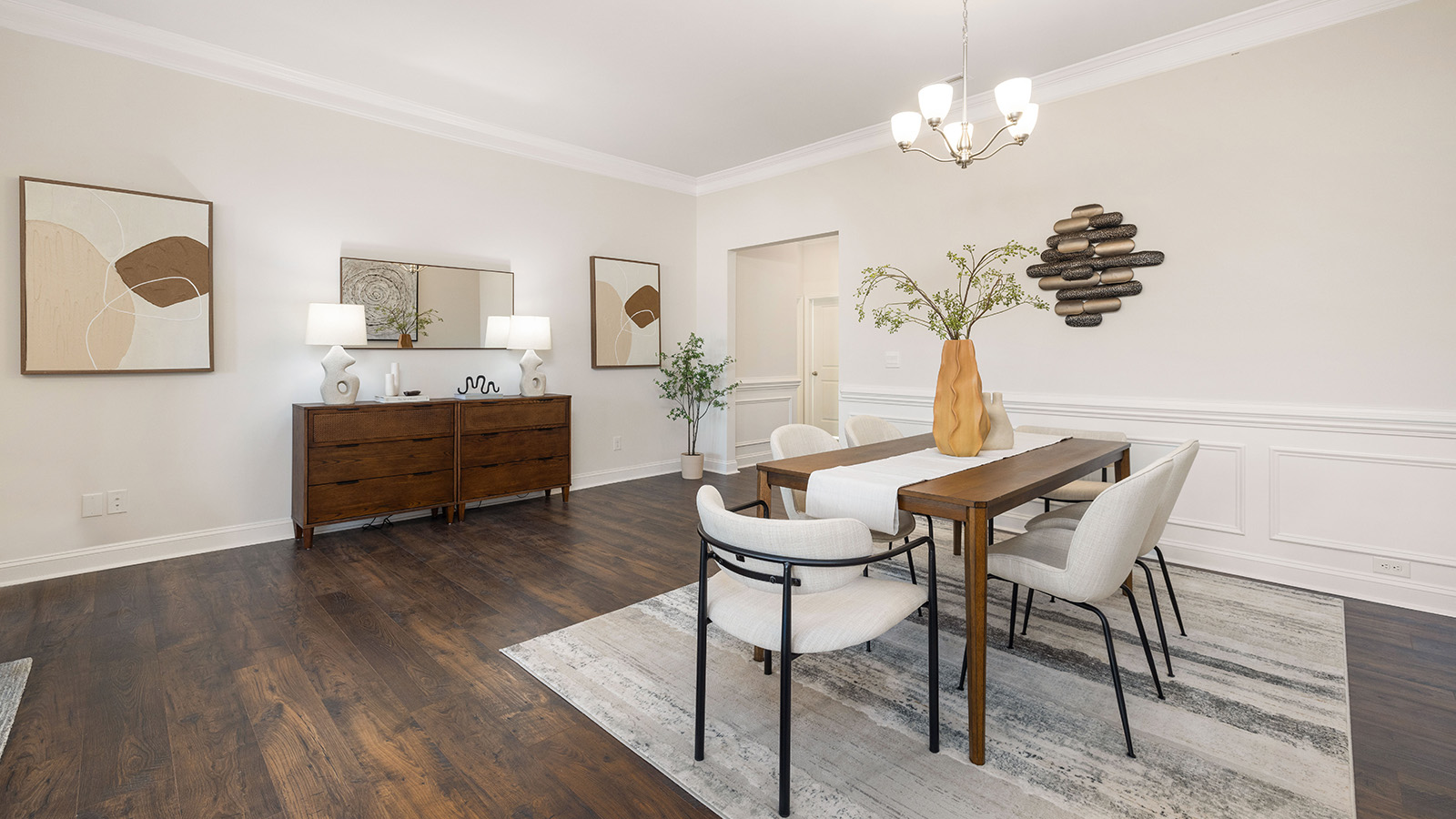 Dining area with wood floors and view of foyer