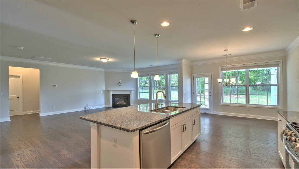 Open concept kitchen with large island and stainless steel appliances