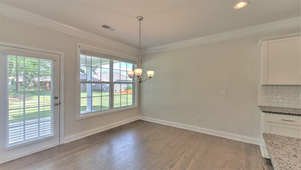 Breakfast area with large windows and exterior glass door