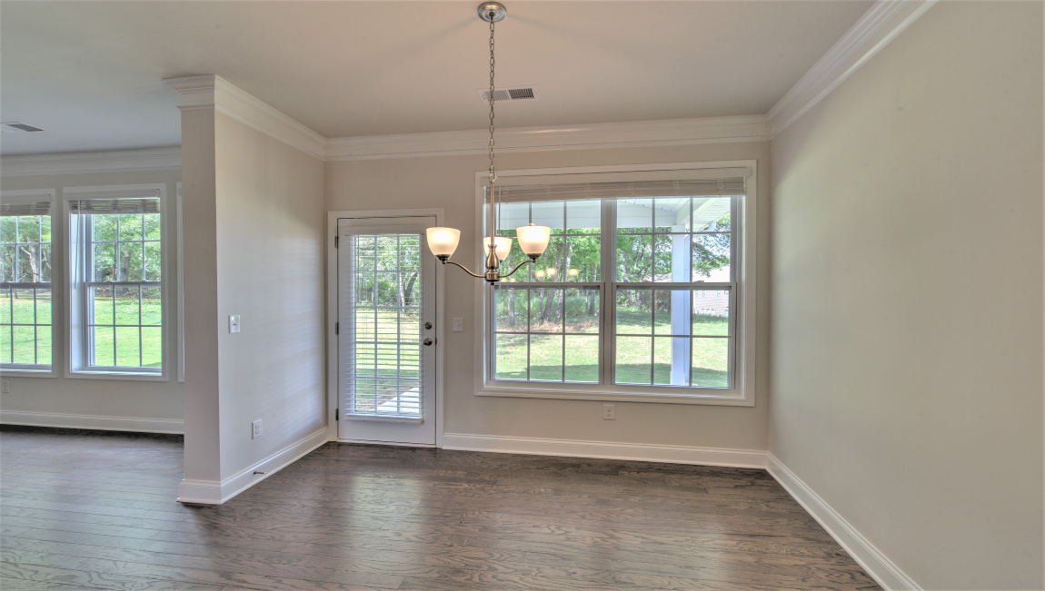Breakfast area with large windows and exterior glass door