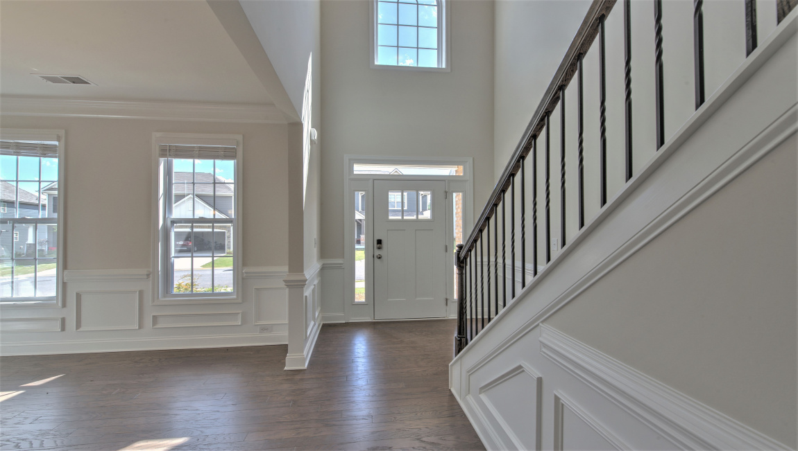 Welcoming foyer with view of formal dining area