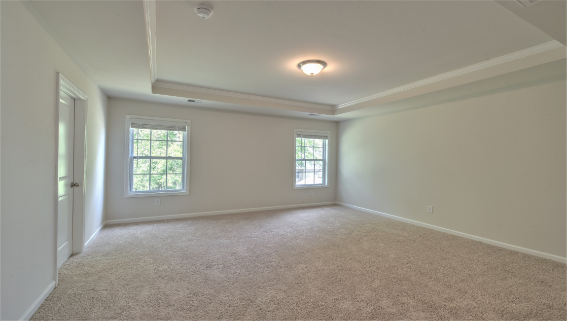 Primary suite with large windows