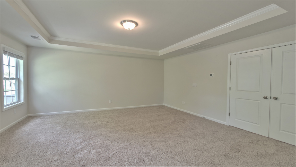 Primary suite with large windows