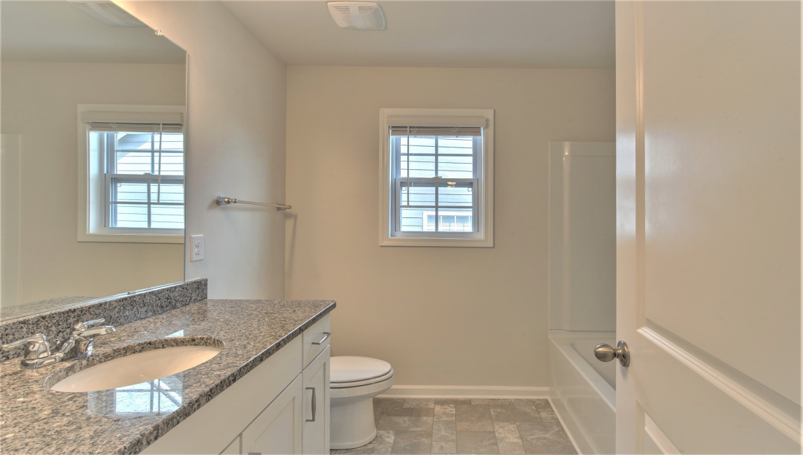 Bathroom with vanity and bathtub