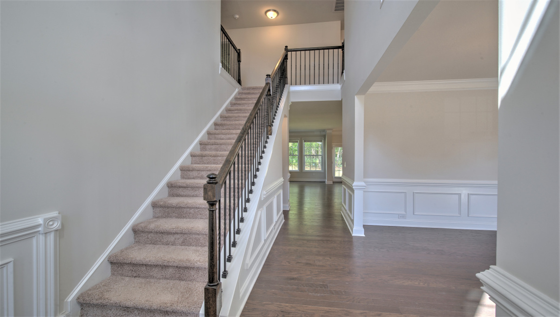 Welcoming foyer with view of formal dining area
