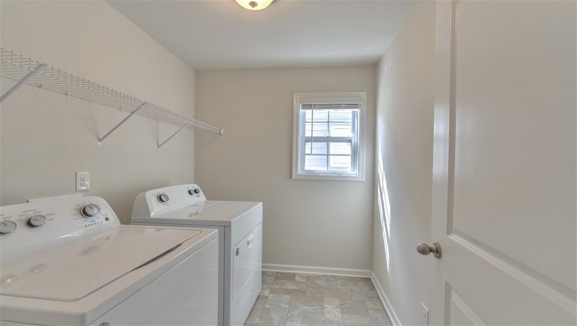 Laundry room with built in shelving