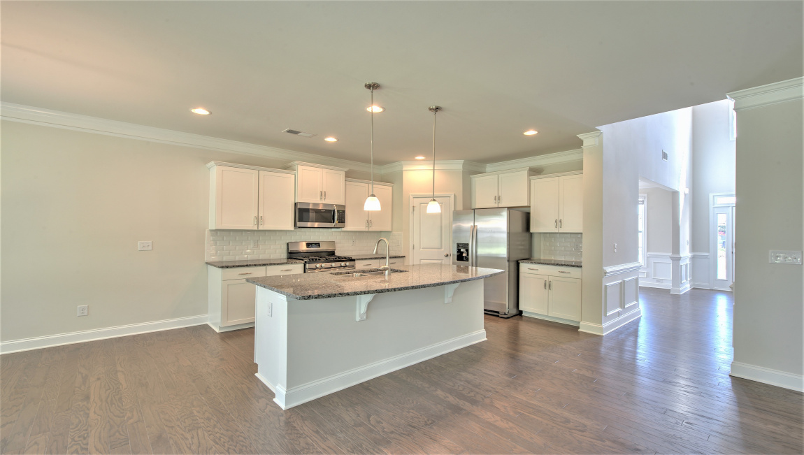 Open concept kitchen with large island and stainless steel appliances