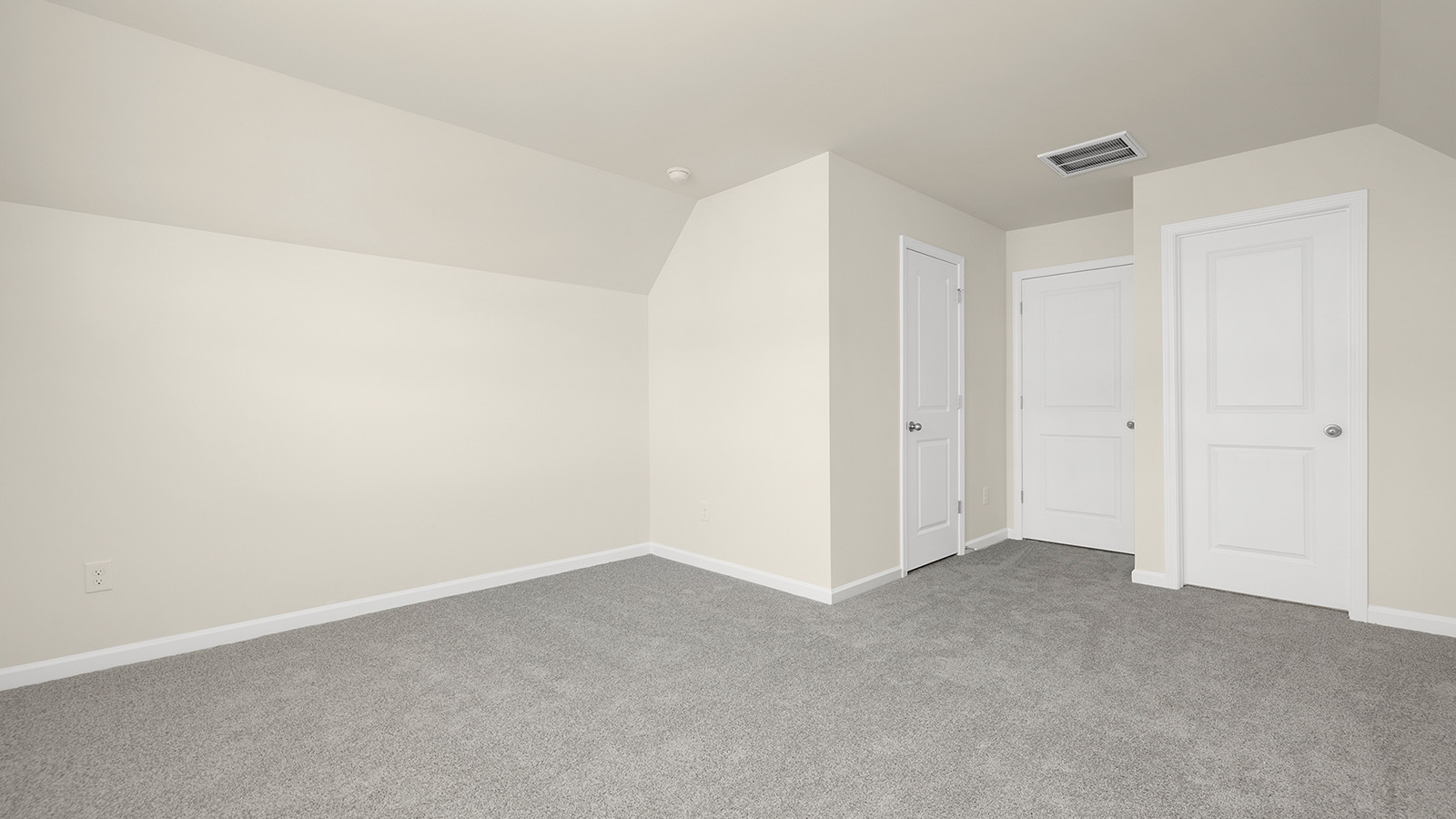 Carpeted bedroom with large window