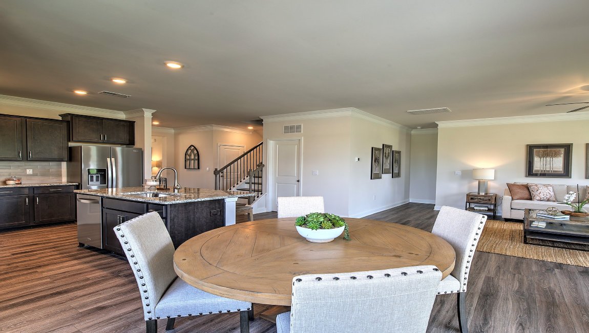 Dining area with view of living room and kitchen