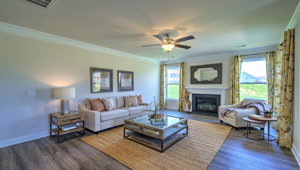 Open living room with fireplace and windows