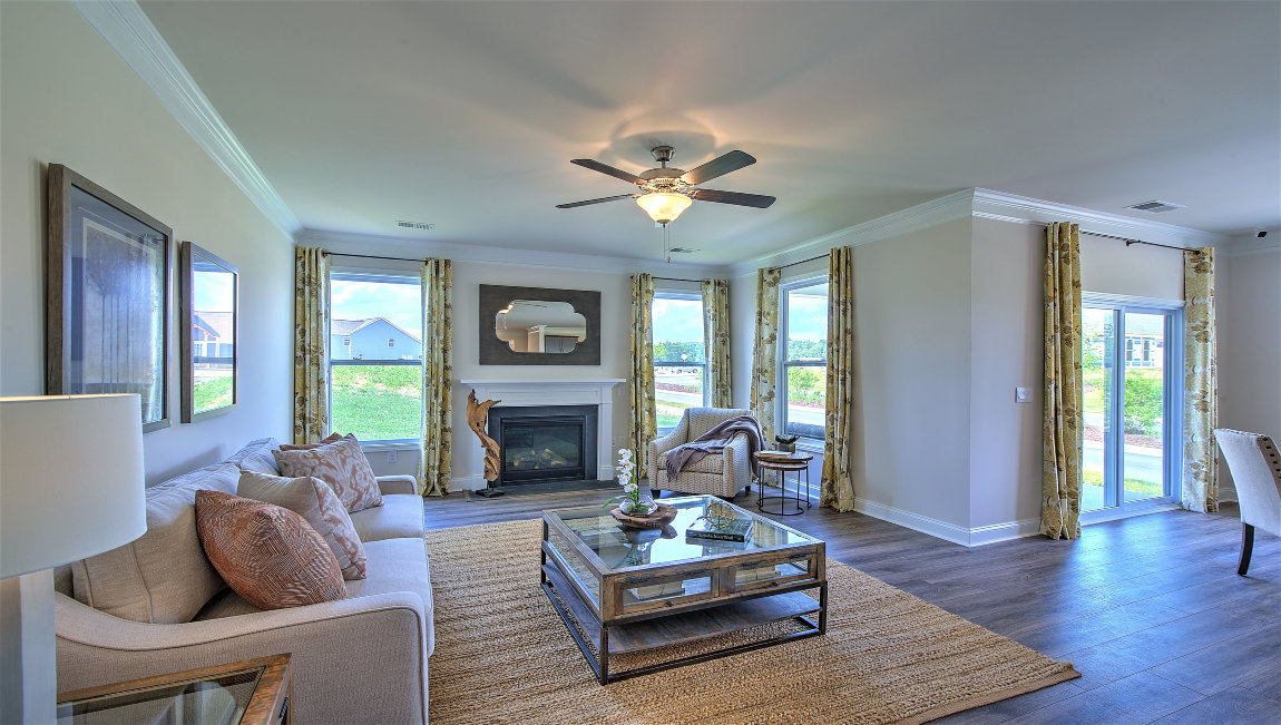 Open living room with fireplace and windows