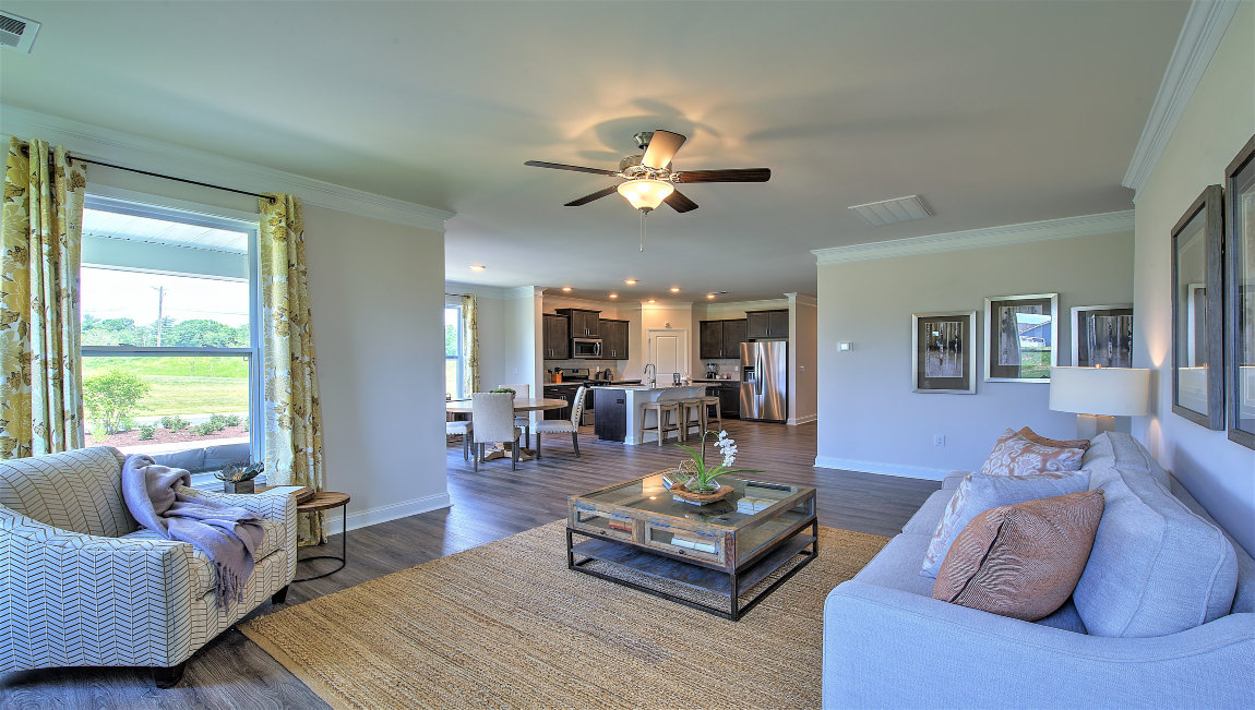 Open living room with fireplace and windows