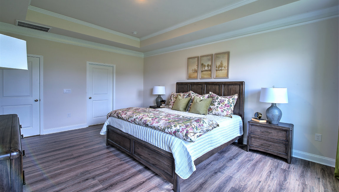 Primary bedroom with large windows