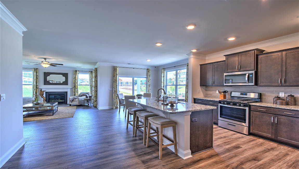 Open kitchen with island and stainless steel appliances