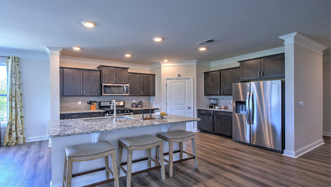 Open kitchen with island and stainless steel appliances