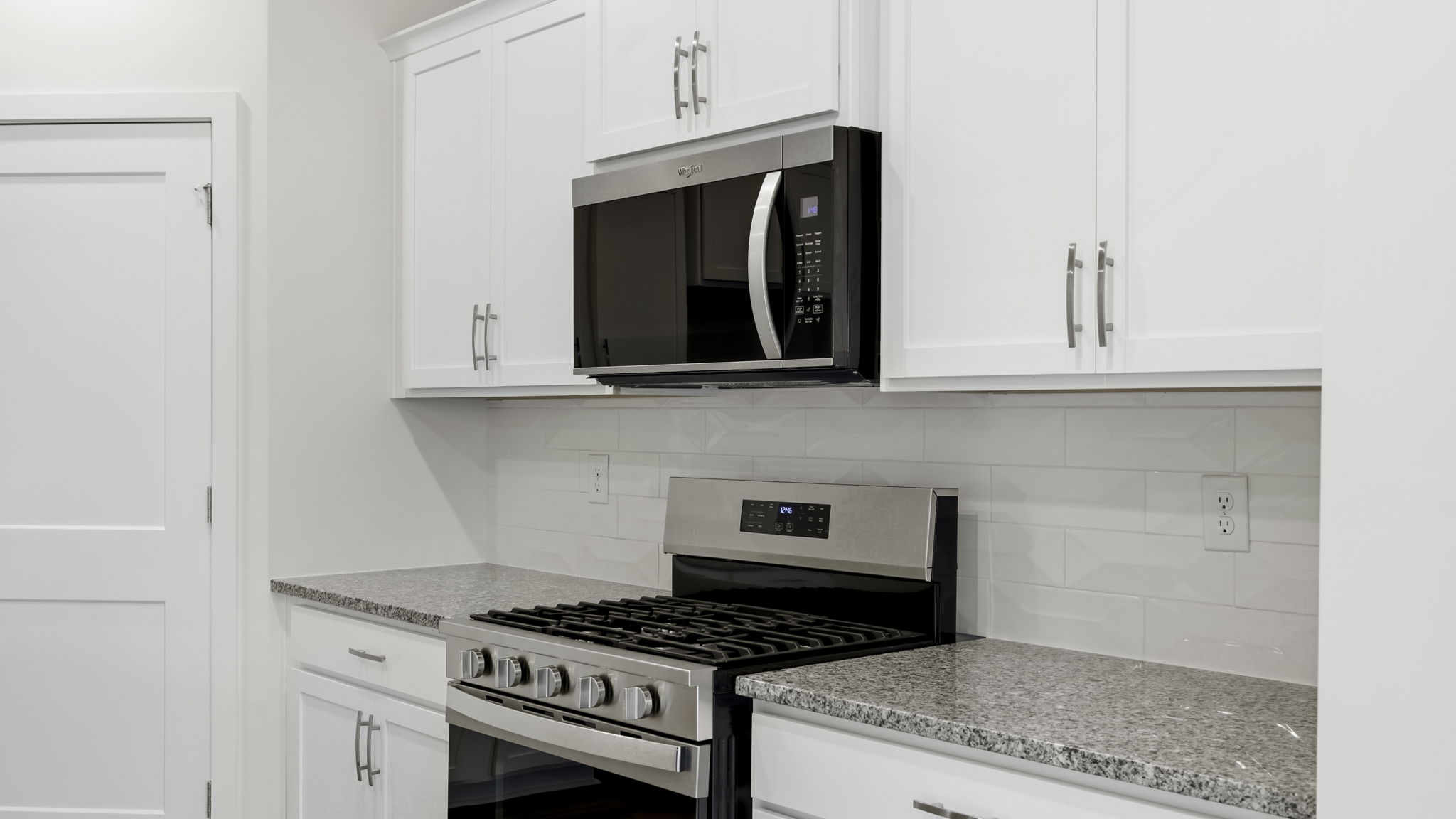 Open concept kitchen with large island and stainless steel appliances