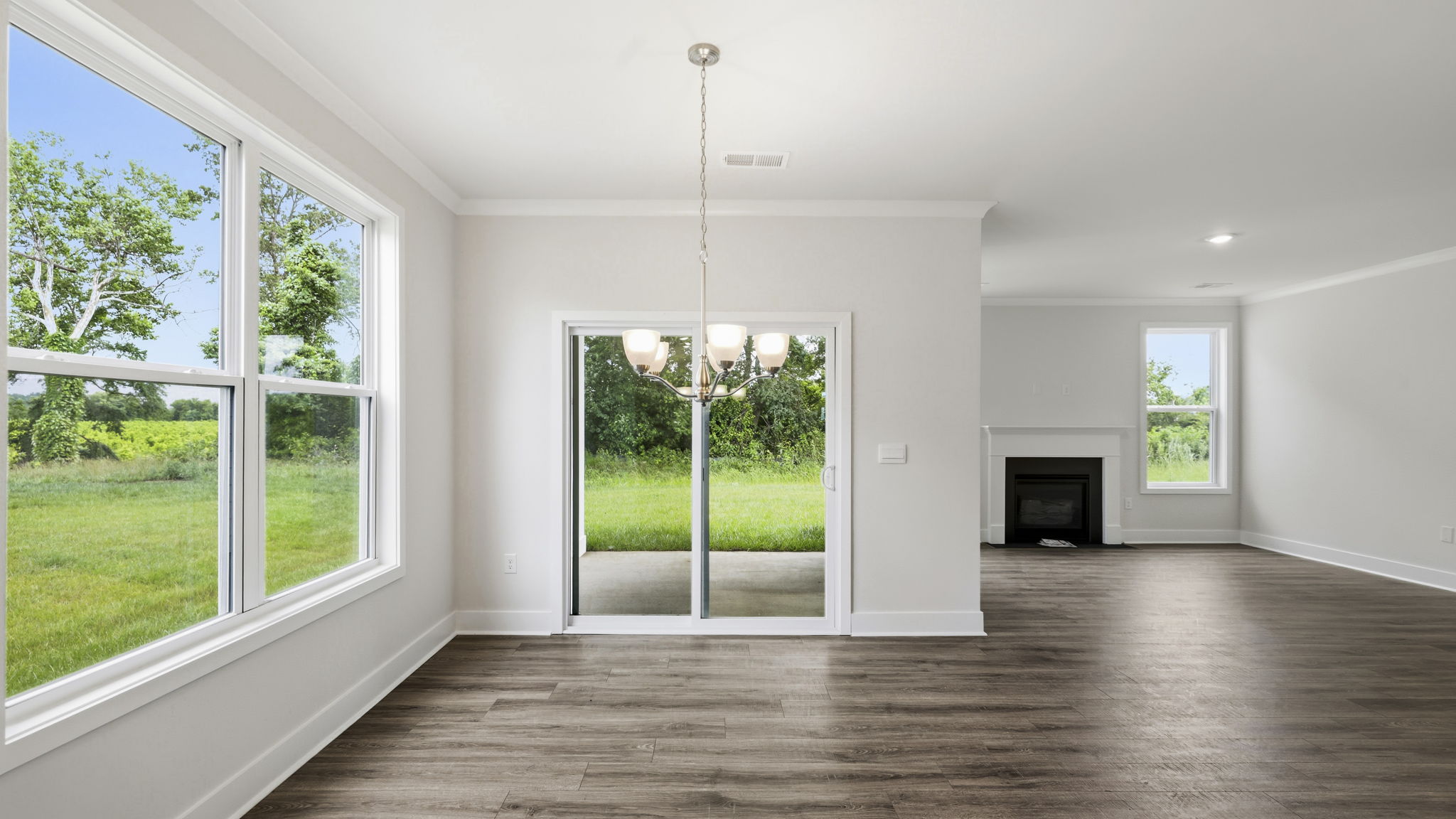 Open dining area with large windows and sliding glass doors
