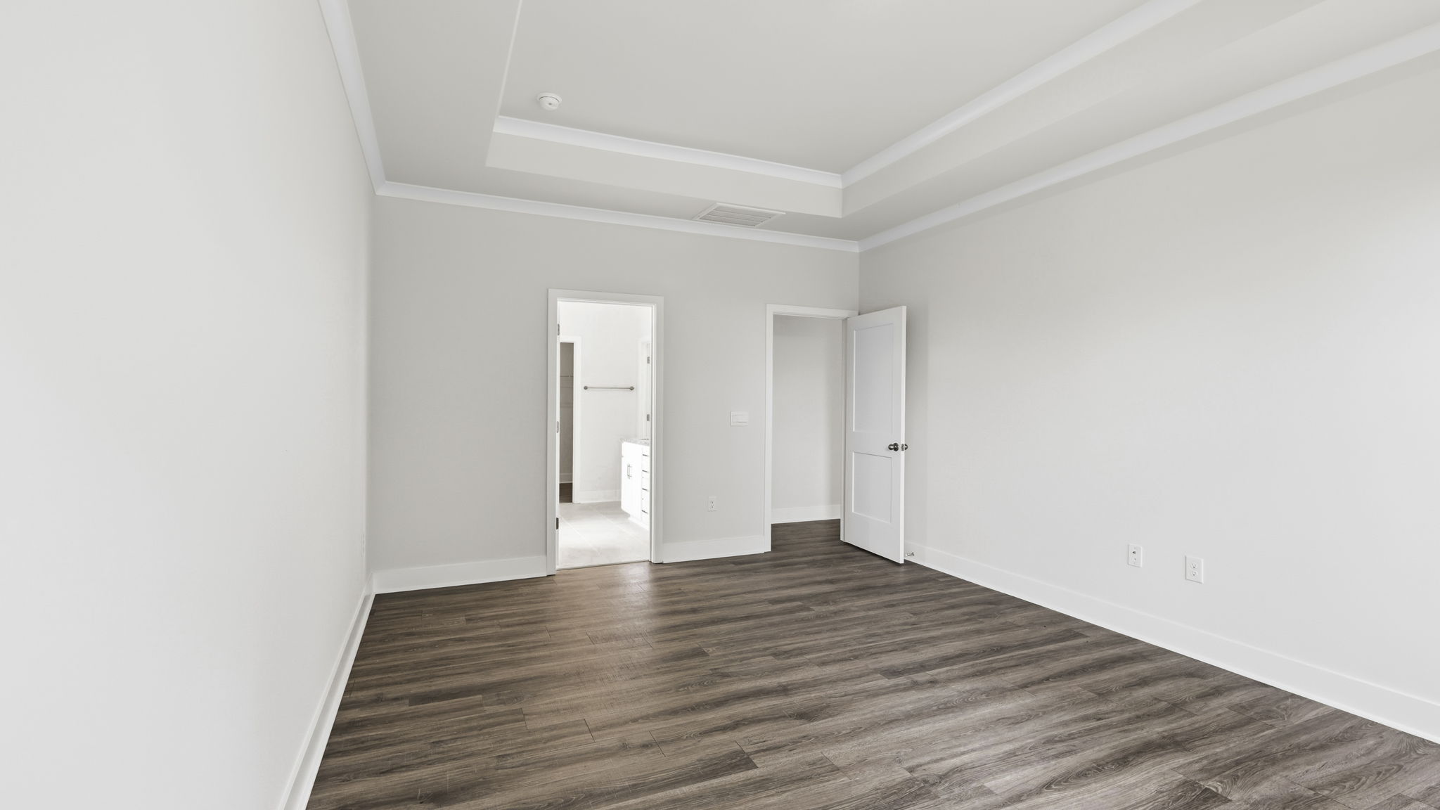 Primary bedrooms with view of attached bathroom