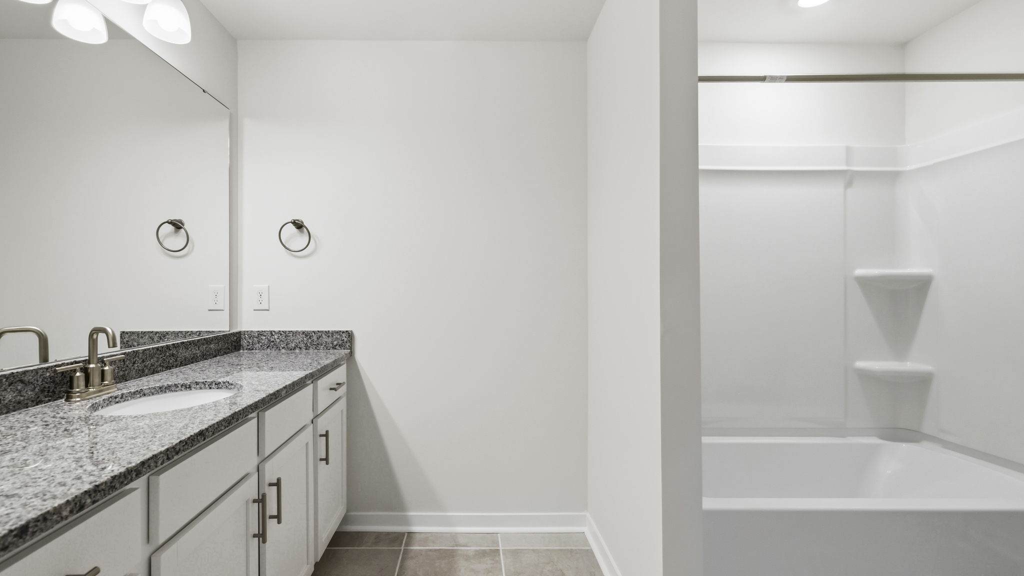 Bathroom with vanity and bathtub