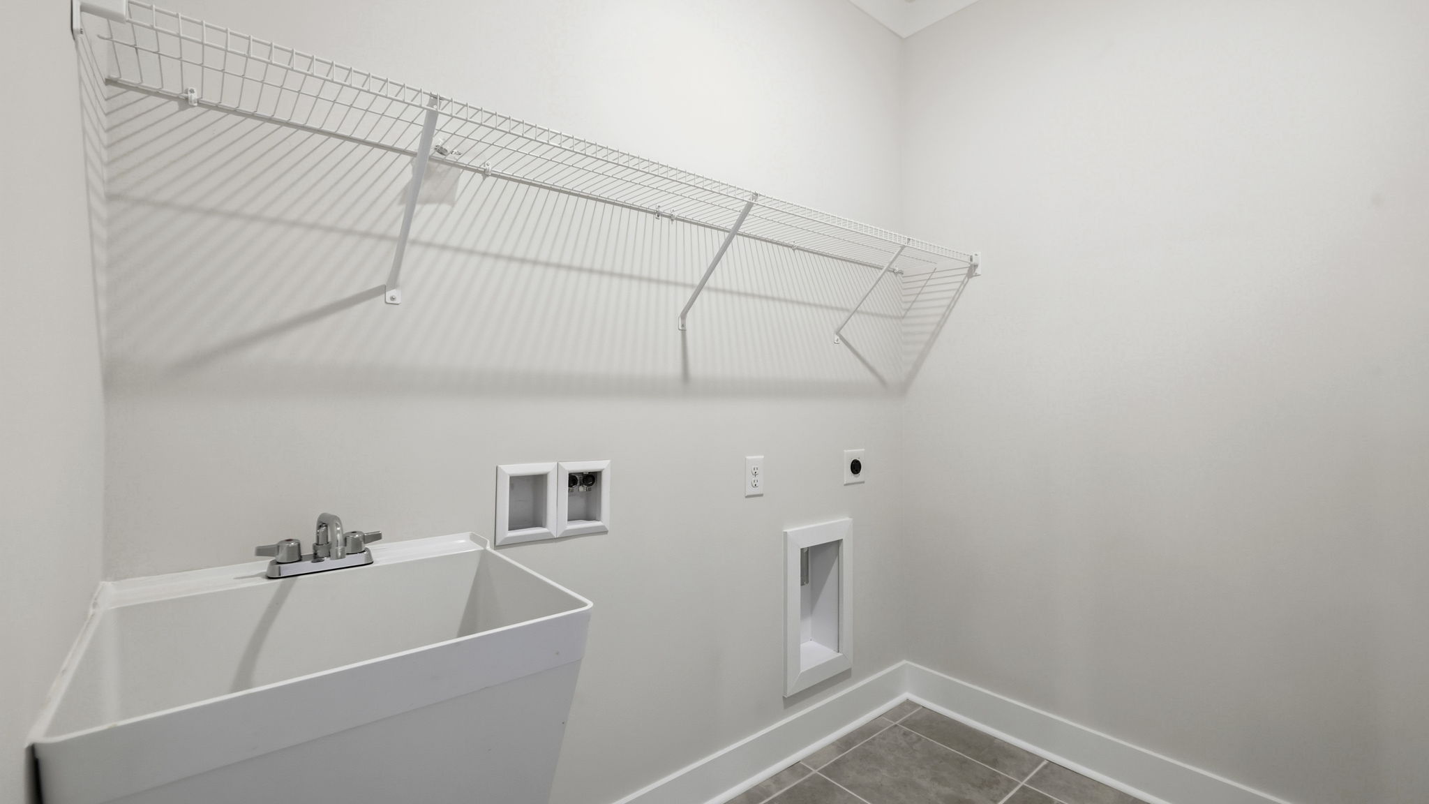 Laundry room with shelving