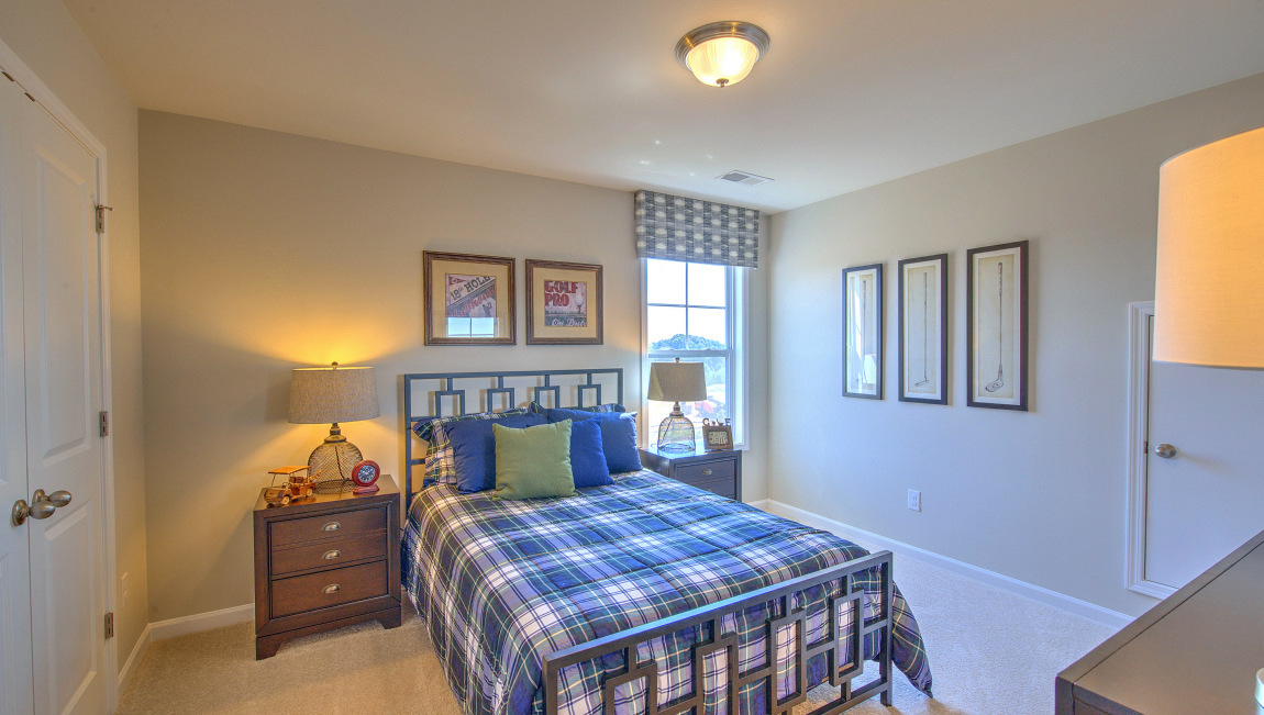 Carpeted bedroom with window