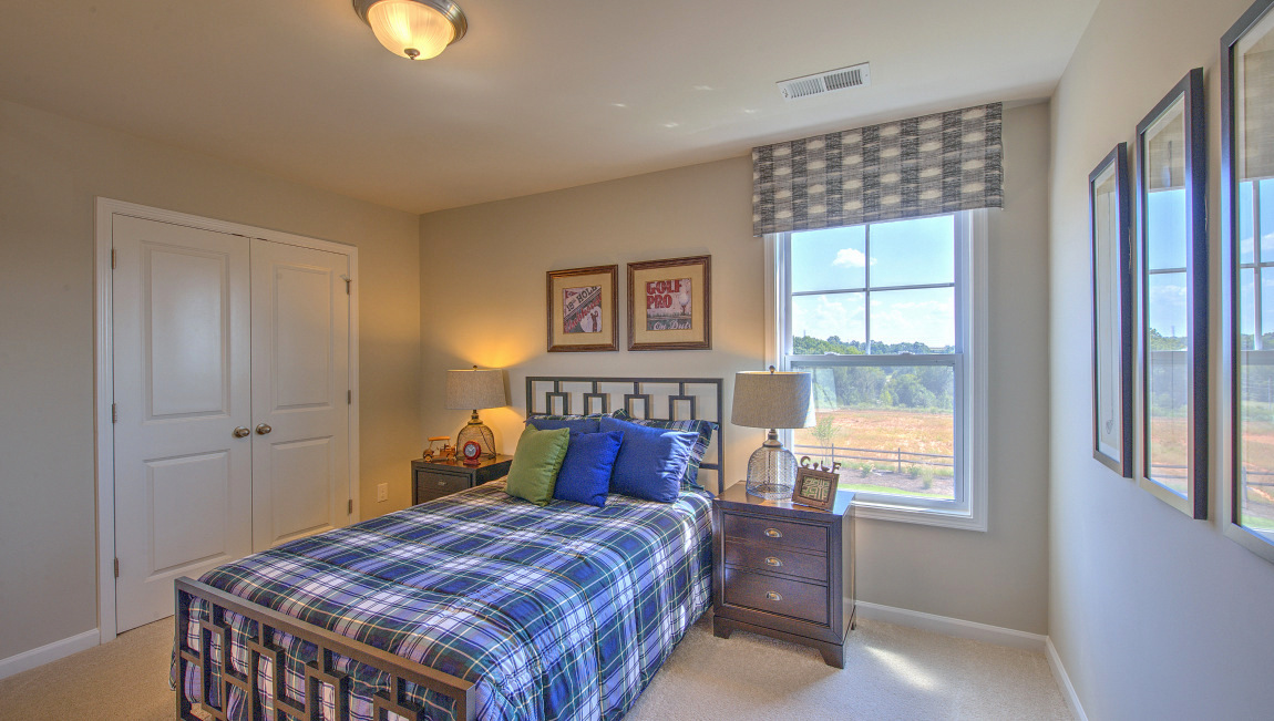 Carpeted bedroom with window