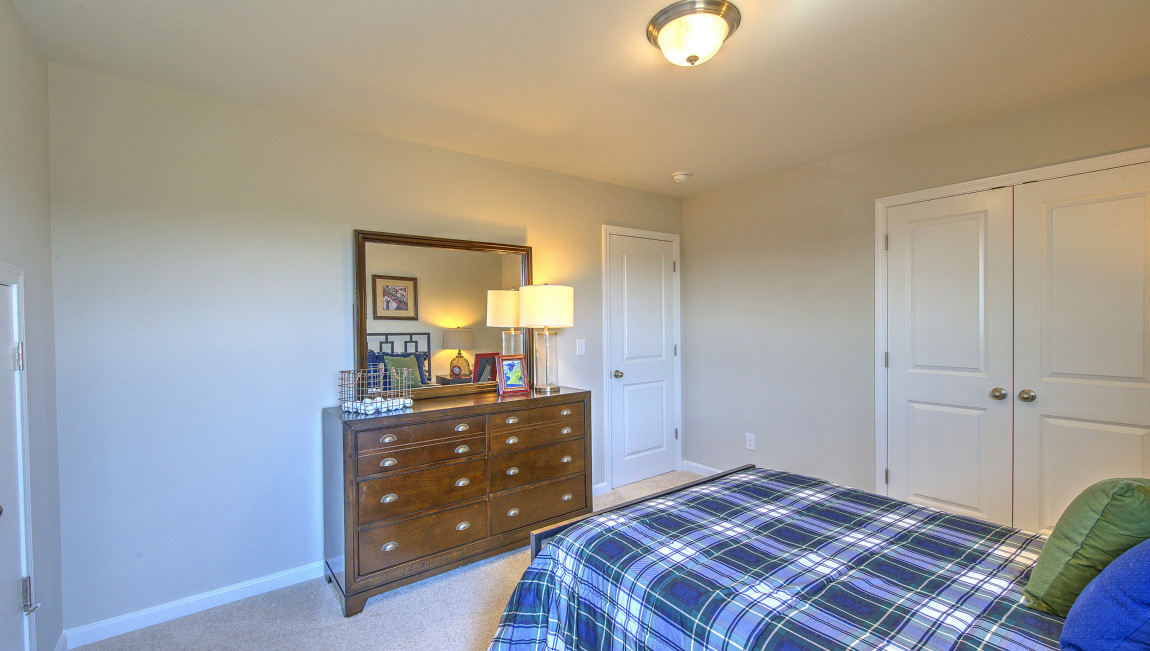 Carpeted bedroom with window