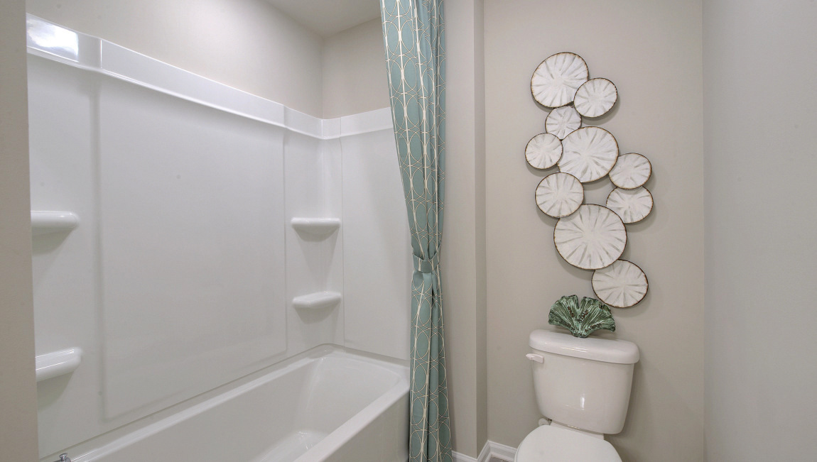 Bathroom with double vanity and tub