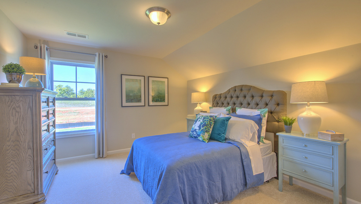 Carpeted bedroom with window