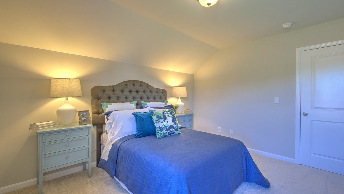 Carpeted bedroom with window