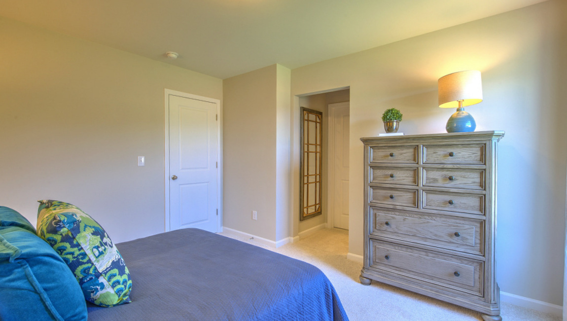 Carpeted bedroom with window