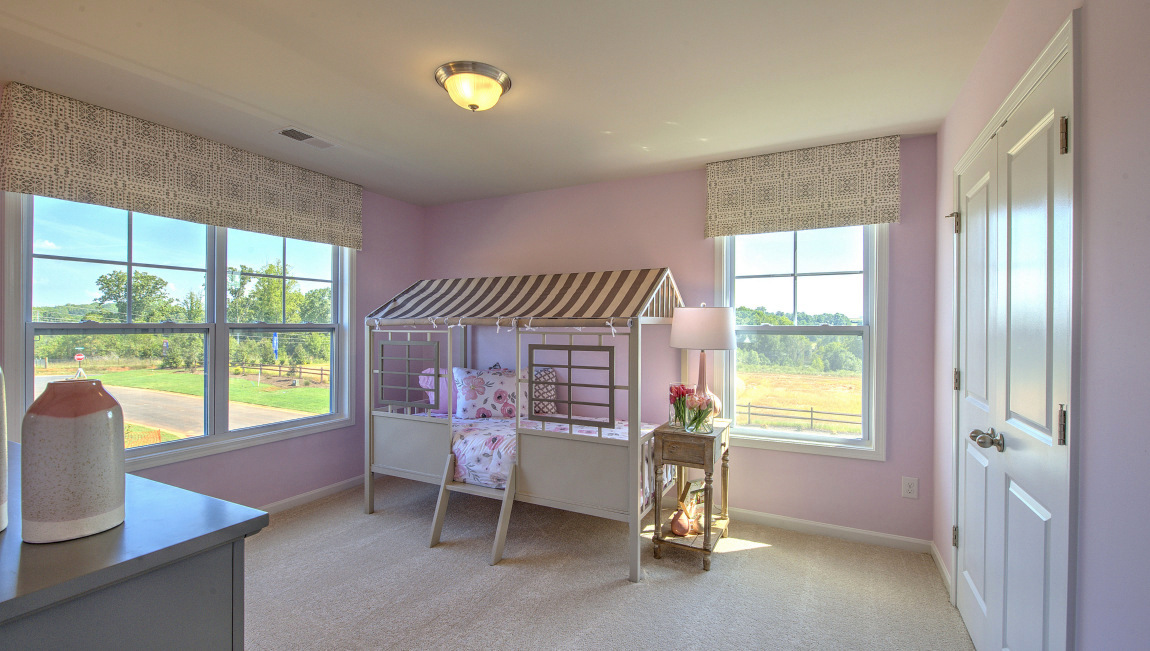 Carpeted bedroom with window