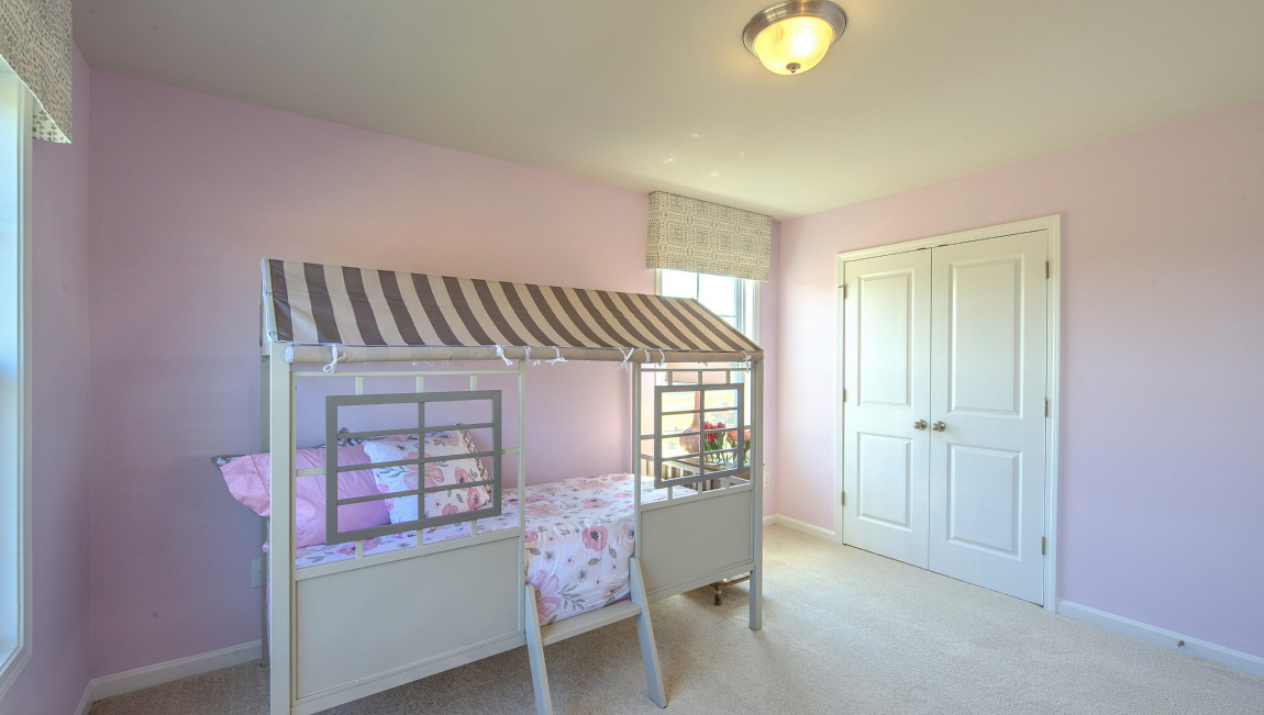 Carpeted bedroom with window
