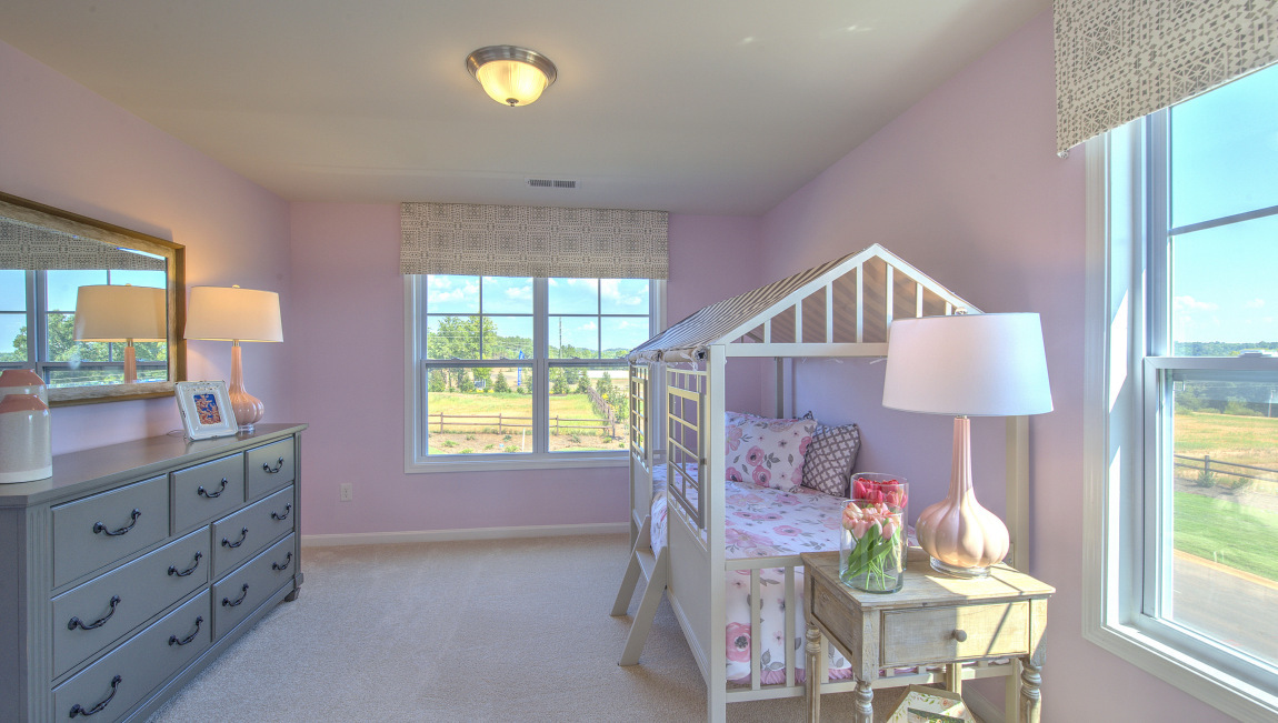 Carpeted bedroom with window