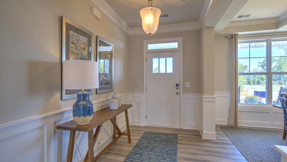 Welcoming foyer with view of dining room