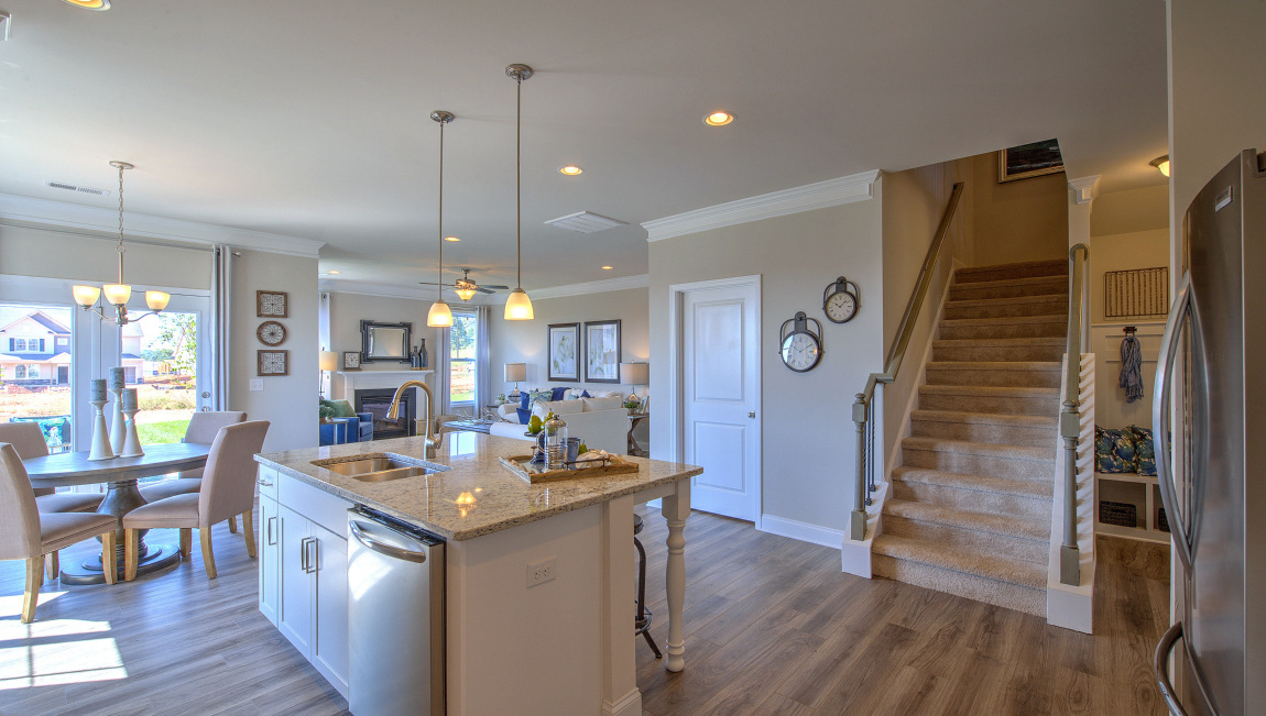Open concept kitchen with island and stainless steel appliances
