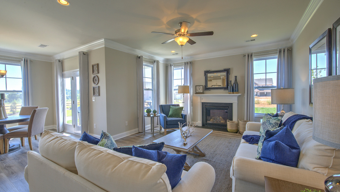 Open family room with large windows and fire place