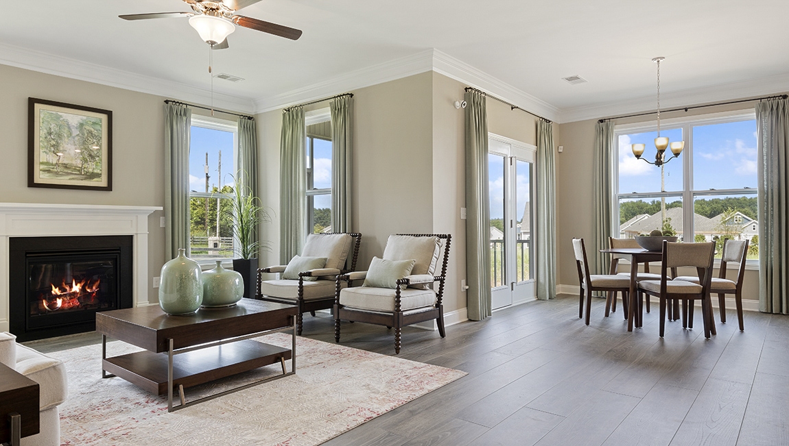 Living room with open view of dining area.