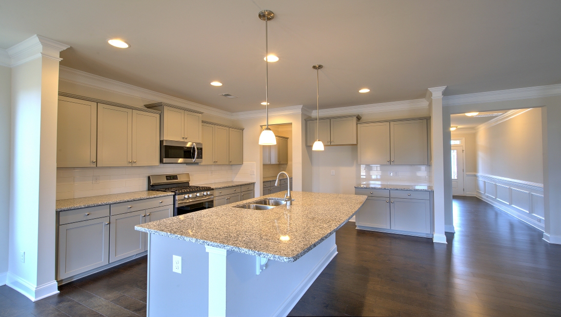 Open kitchen with large island and stainless steel appliances