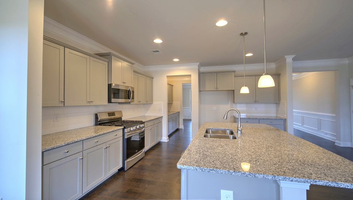 Open kitchen with large island and stainless steel appliances