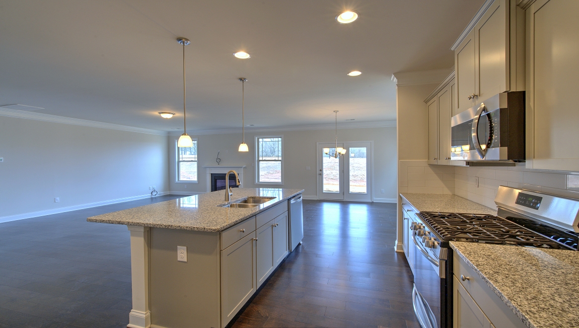 Open kitchen with large island and stainless steel appliances
