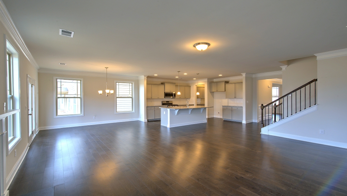 Open living room with large windows and gas fireplace