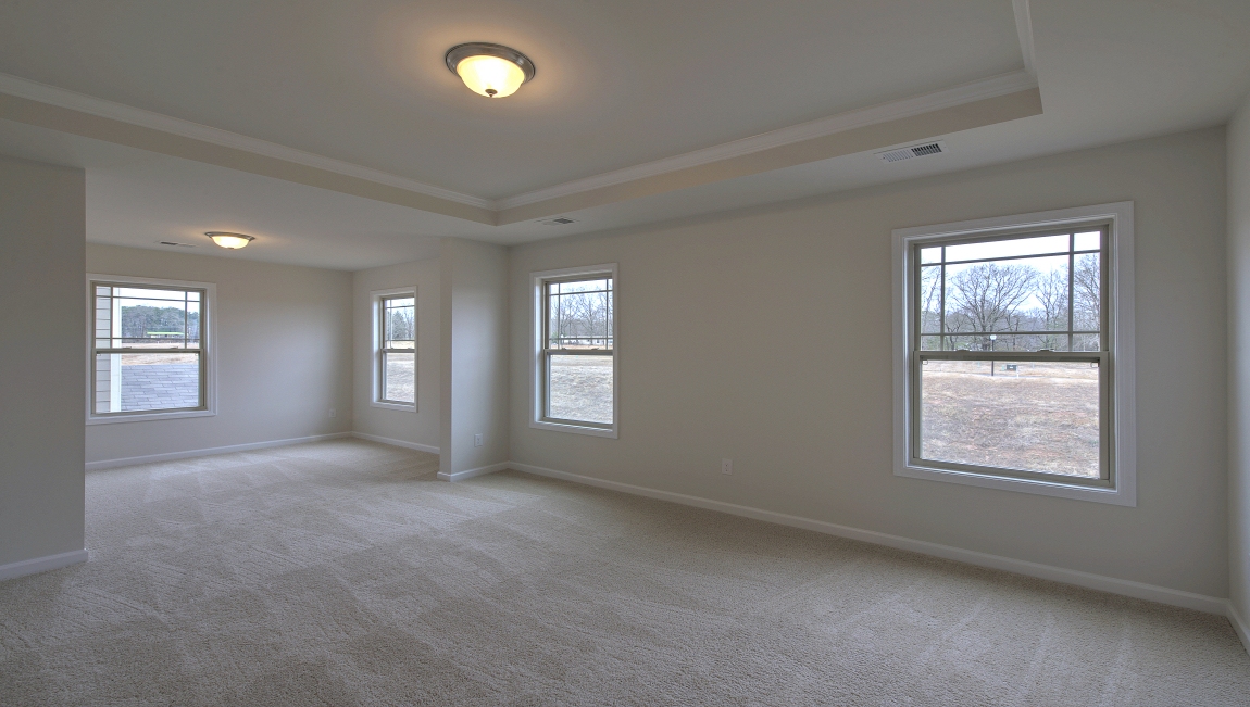 Primary suite with large windows