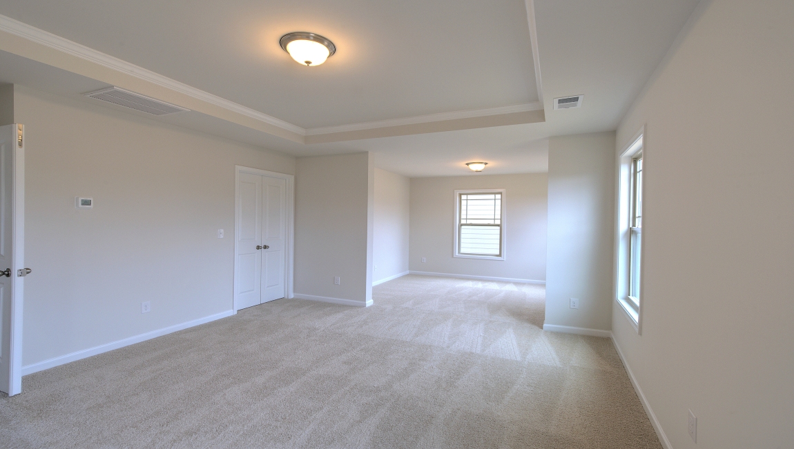 Primary suite with large windows