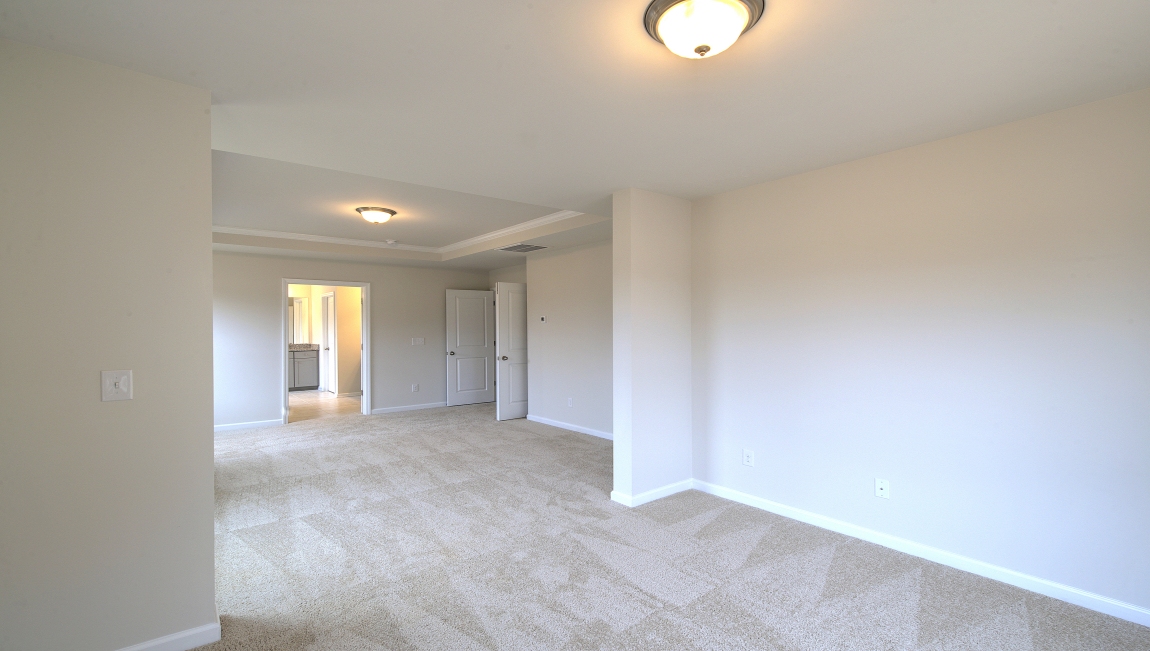 Primary suite with large windows