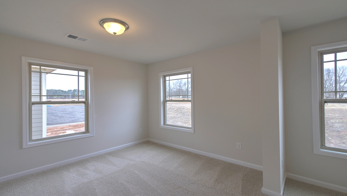 Primary suite with large windows