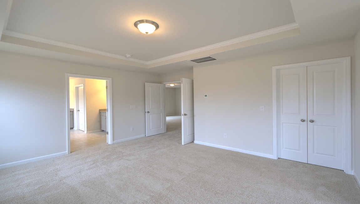 Primary suite with large windows