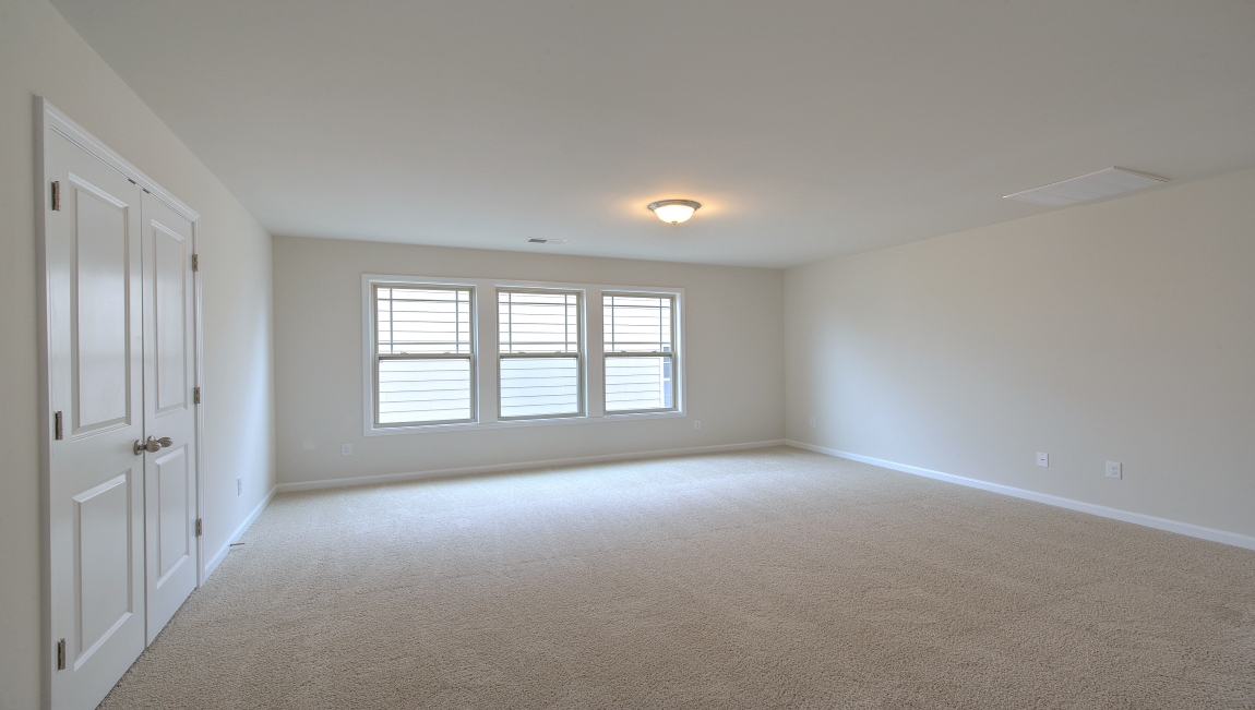 Carpeted loft with window