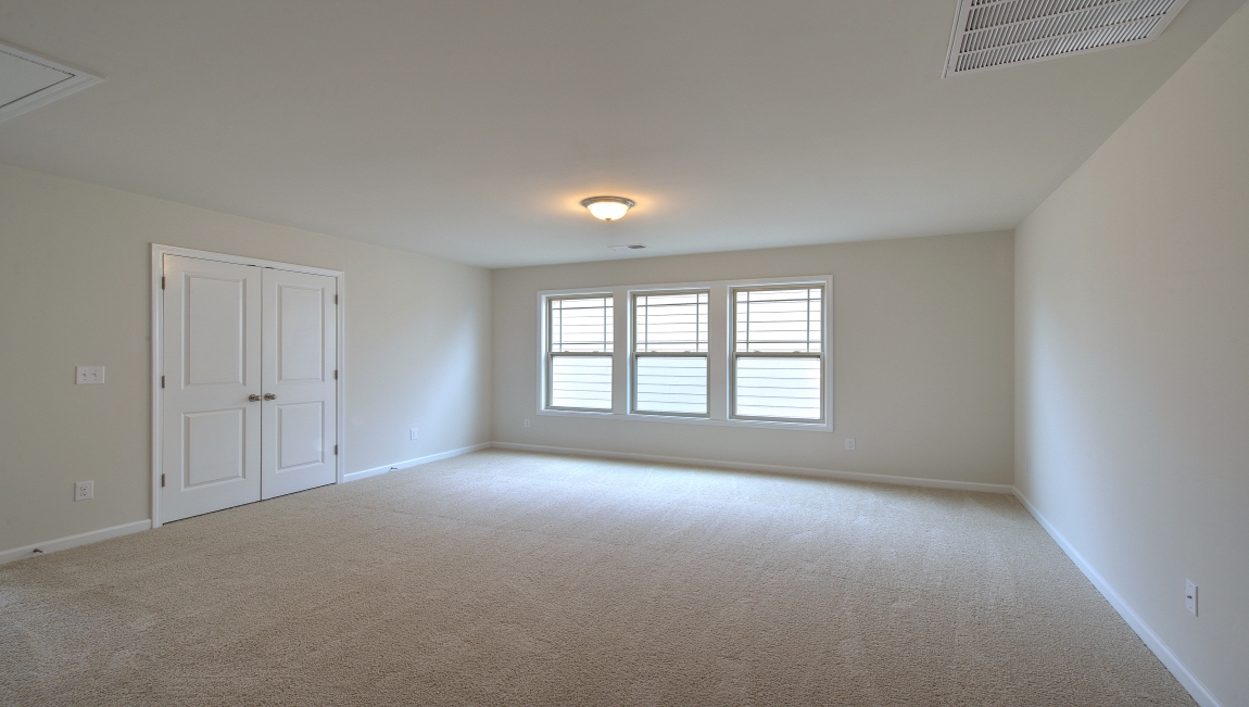 Carpeted loft with window
