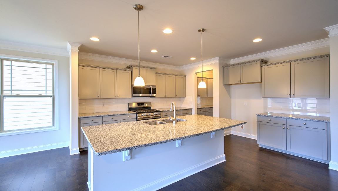 Open kitchen with large island and stainless steel appliances